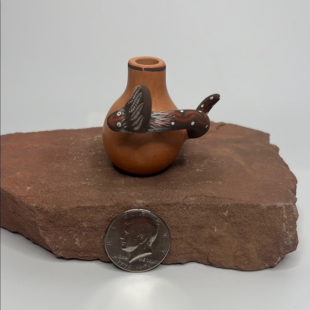 Handcrafted Pottery Vase with Serpent Design.